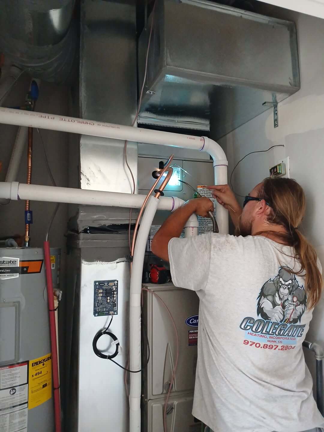 hvac tech updating unit Colegate Nunn CO
